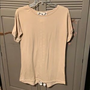 Beige t-shirt with lace back.